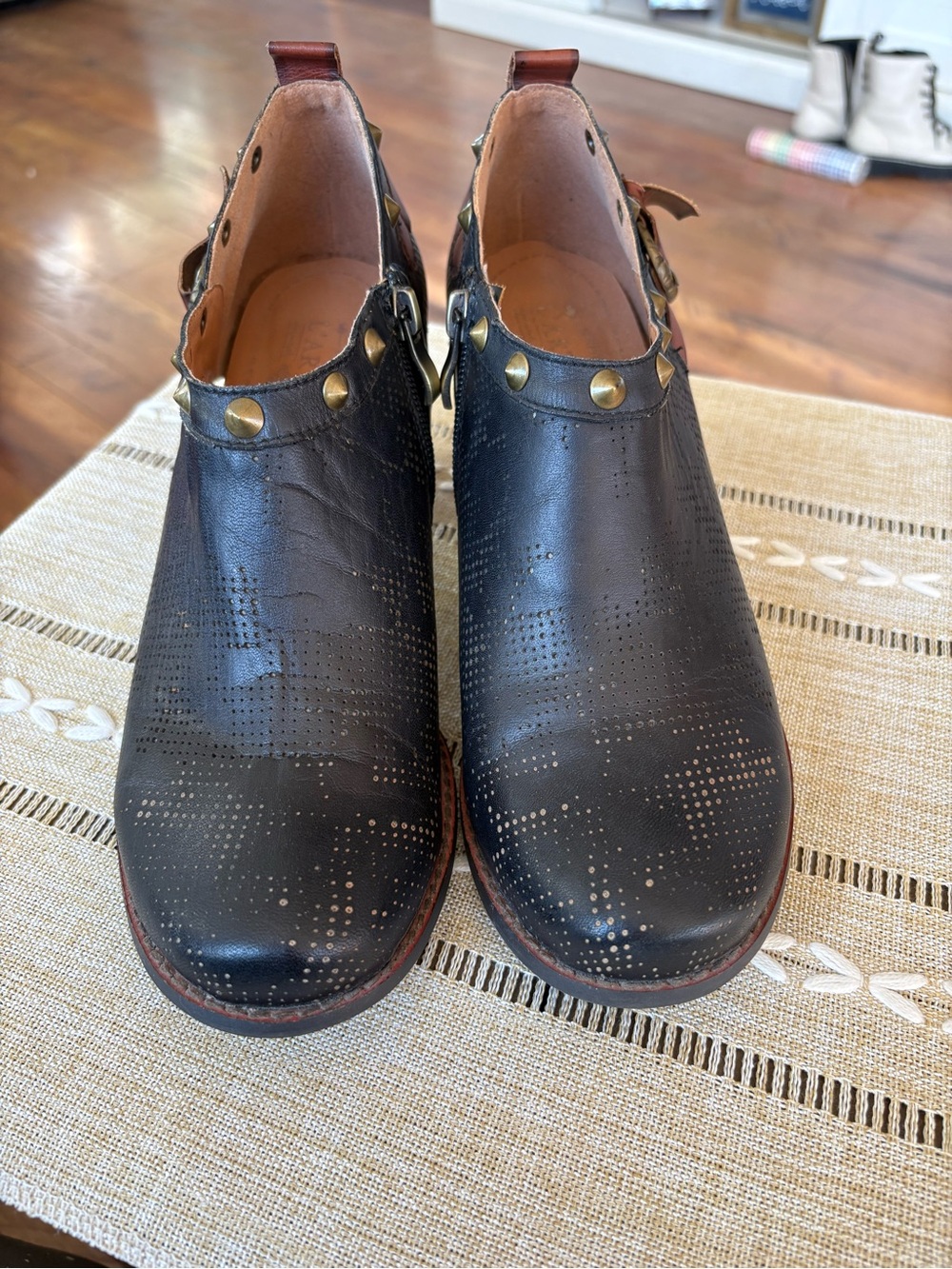 L’artiste Black Perforated Leather Ankle Booties with Brass Stud Trim